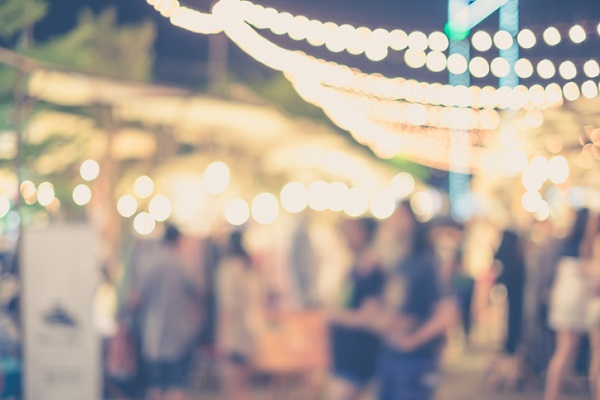 Abstract blurred people in street market